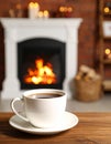 Cup of hot drink near fireplace at home. Space for text Royalty Free Stock Photo