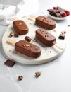 Delicious glazed ice cream bars and chocolate on light grey marble table Royalty Free Stock Photo