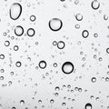 Rain drops on glass against grey background Royalty Free Stock Photo