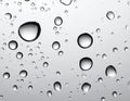 Rain drops on glass against grey background Royalty Free Stock Photo
