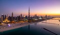 Stunning Dubai skyline at dusk with Burj Khalifa and vibrant city lights reflecting on the Arabian Gulf Royalty Free Stock Photo