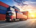 A modern white freight truck travels along a port road at sunset Royalty Free Stock Photo