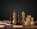 Different chess pieces on dark background. Space for text Royalty Free Stock Photo