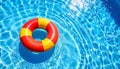Inflatable ring floating in swimming pool on sunny day, top view with space for text Royalty Free Stock Photo