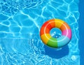 Inflatable ring floating in swimming pool on sunny day, top view with space for text Royalty Free Stock Photo