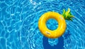 Inflatable ring floating in swimming pool on sunny day, top view with space for text Royalty Free Stock Photo