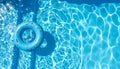 Inflatable ring floating in swimming pool on sunny day, top view with space for text Royalty Free Stock Photo