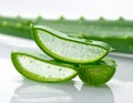 Close-up of a sliced Aloe vera leaf on a wooden surface. Royalty Free Stock Photo