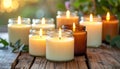 A collection of ritual candles glowing warmly in glass jars, placed on a rustic wooden surface Royalty Free Stock Photo