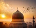 Beautiful mosque with golden dome and flying doves at colorful sunrise sky Royalty Free Stock Photo