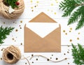 Rustic Christmas Card Preparation with Twine and Evergreen Royalty Free Stock Photo