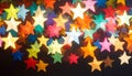 Colorful Star-Shaped Bokeh Lights on Dark Background Royalty Free Stock Photo