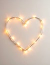 Heart-Shaped String Lights on Neutral Background Royalty Free Stock Photo