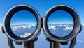 Binoculars with blue sky and clouds reflected in the lenses - future vision metaphor Royalty Free Stock Photo