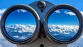 Binoculars with blue sky and clouds reflected in the lenses - future vision metaphor Royalty Free Stock Photo