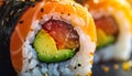Extreme macro close up of uramaki sushi roll with salmon avocado tuna and red roe topped with sesame seeds Royalty Free Stock Photo