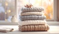 Cozy Knitted Sweaters Stacked by Window Royalty Free Stock Photo