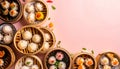 Overhead flat lay of colorful steamed dim sum shumai and dumplings in bamboo steamer baskets arranged on pink background Royalty Free Stock Photo
