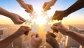 Teamwork and Unity Hands Holding Puzzle Pieces at Sunset Royalty Free Stock Photo