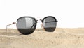 Stylish sunglasses on sand against white background. Space for text Royalty Free Stock Photo