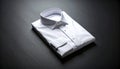 Folded White Dress Shirt on Smooth Matte Black Surface Royalty Free Stock Photo
