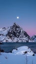 Winter full moon next to the Skolmen mountain peak, Lofoten Islands, Norway Royalty Free Stock Photo