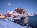 Winter full moon next to the Skolmen mountain peak, Lofoten Islands, Norway Royalty Free Stock Photo