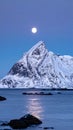 Winter full moon next to the Skolmen mountain peak, Lofoten Islands, Norway Royalty Free Stock Photo