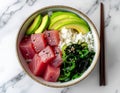 Hawaiian Tuna Poke Bowl with Avocado and Seaweed Salad Royalty Free Stock Photo