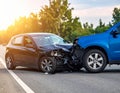 The scene of the car crash where a blue vehicle hit a black car on the road Royalty Free Stock Photo
