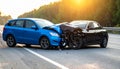 The scene of the car crash where a blue vehicle hit a black car on the road Royalty Free Stock Photo