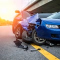 The scene of the car crash where a blue vehicle hit a black car on the road Royalty Free Stock Photo