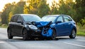 The scene of the car crash where a blue vehicle hit a black car on the road Royalty Free Stock Photo