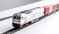 Freight train model with containers on white tabletop, logistics theme Royalty Free Stock Photo