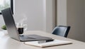 Minimalist workspace with laptop, notebook and coffee cup Royalty Free Stock Photo