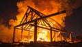 Inferno: Wooden Structure Engulfed in Flames at Night Royalty Free Stock Photo