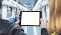 People holding tablet with blank white screen in subway train Royalty Free Stock Photo