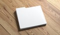 Blank White Folder Mockup on Wooden Surface Royalty Free Stock Photo