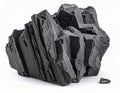 Near a jagged, dark gray, huge boulder, like basalt on a white background Royalty Free Stock Photo
