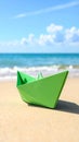 Light green paper boat near sea on sandy beach, space for text Royalty Free Stock Photo