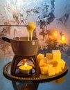 Cozy Winter Fondue Scene with Warm Golden Glow Royalty Free Stock Photo