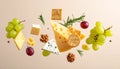 Different types of cheese, crackers, grapes, rosemary and walnuts in air on dark beig Royalty Free Stock Photo