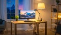A comfortable workplace with a computer and lamp on the wooden desk in the home Office Royalty Free Stock Photo