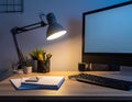 A comfortable workplace with a computer and lamp on the wooden desk in the home Office Royalty Free Stock Photo