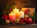 Traditional christmas decoration on wooden background with candles and gifts Royalty Free Stock Photo