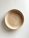 Top-Down View of Round Woven Basket on Matte White Background Royalty Free Stock Photo