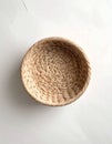 Top-Down View of Round Woven Basket on Matte White Background Royalty Free Stock Photo