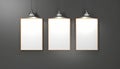 Gallery Wall Mockup with Three Blank Frames and Spotlights Royalty Free Stock Photo