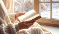 Generated image Hands holding open book near window, warm soft light, blurred cozy background, lifestyle mood Royalty Free Stock Photo