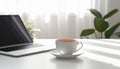 Cup of Tea beside Laptop on Minimal Desk Royalty Free Stock Photo